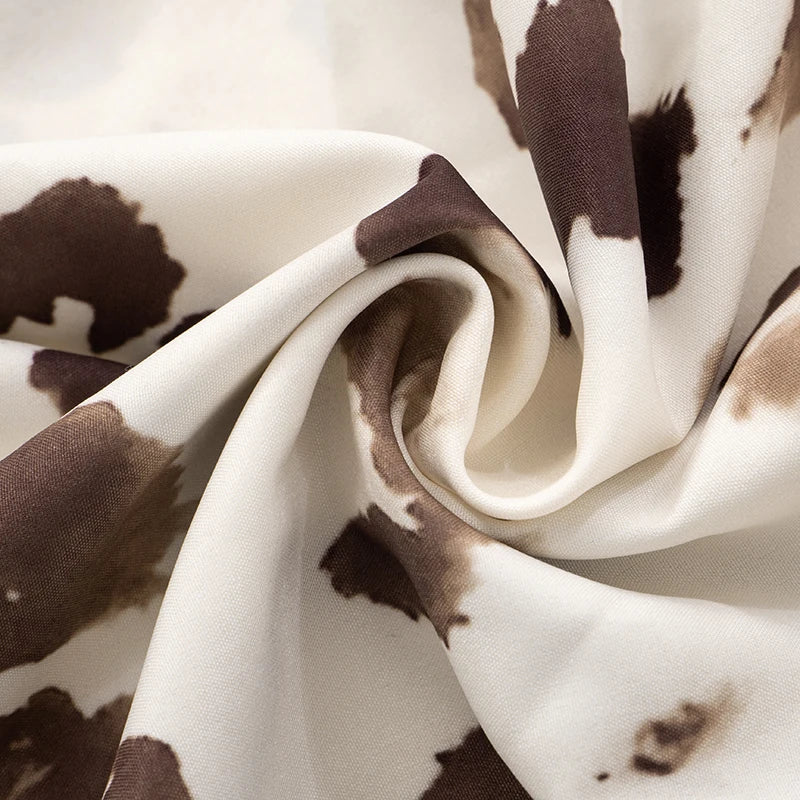 ROVIOO CUTENOVA Cow Print Halter Neck Mini Dress